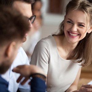 Woman showing off straighter smile at work
