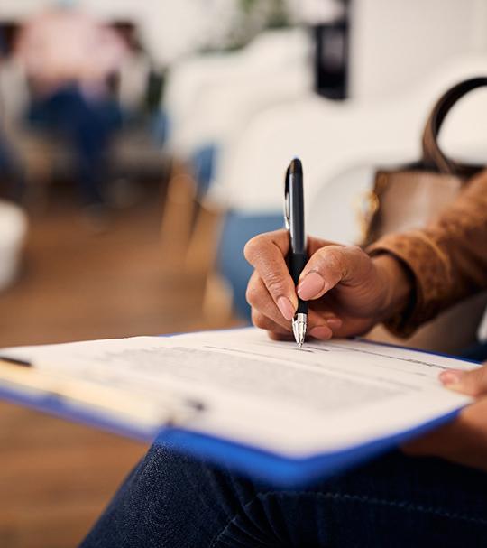 Patient filling out forms in lobby