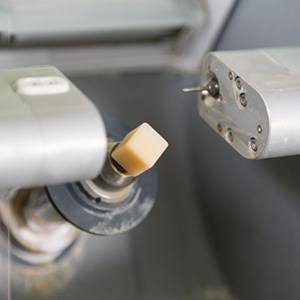 Close up of a porcelain block resting in a CEREC machine