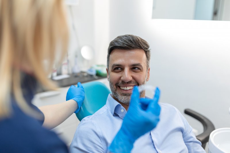 man receiving clear aligners 