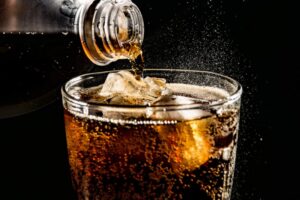 Cola being poured into a glass
