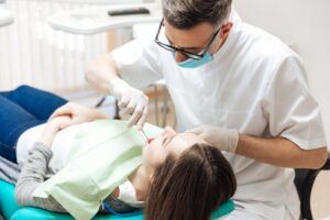 Dentist working on patient.